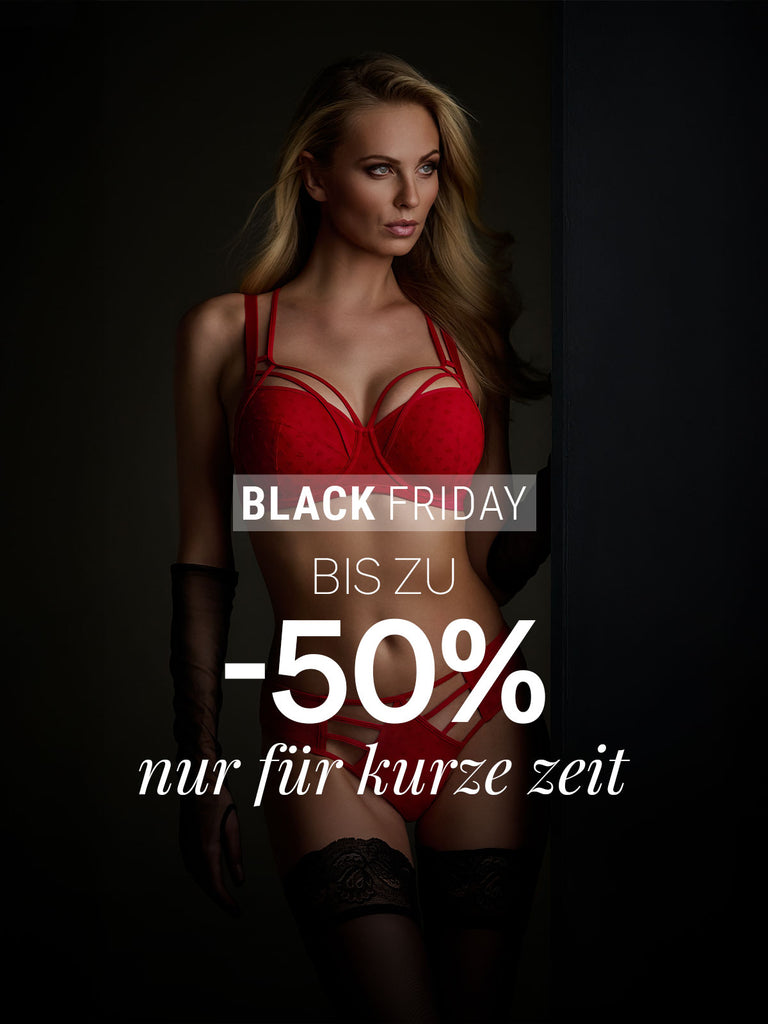 Woman in the art of love red heart lingerie from marlies|dekkers with Black Friday sale text on a dark background for black friday deals