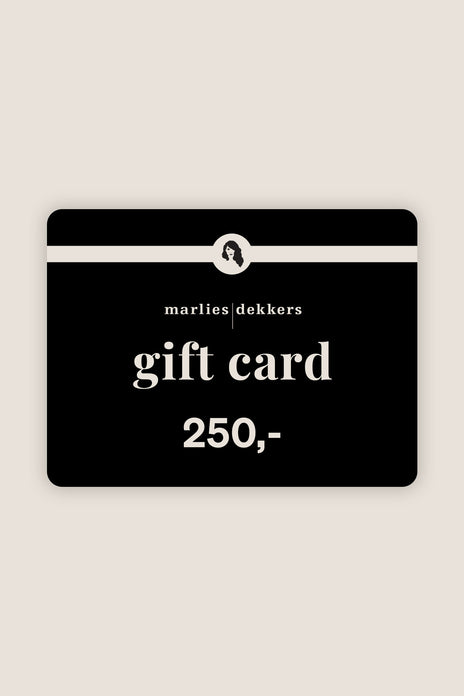 Black gift card with white text on a beige background