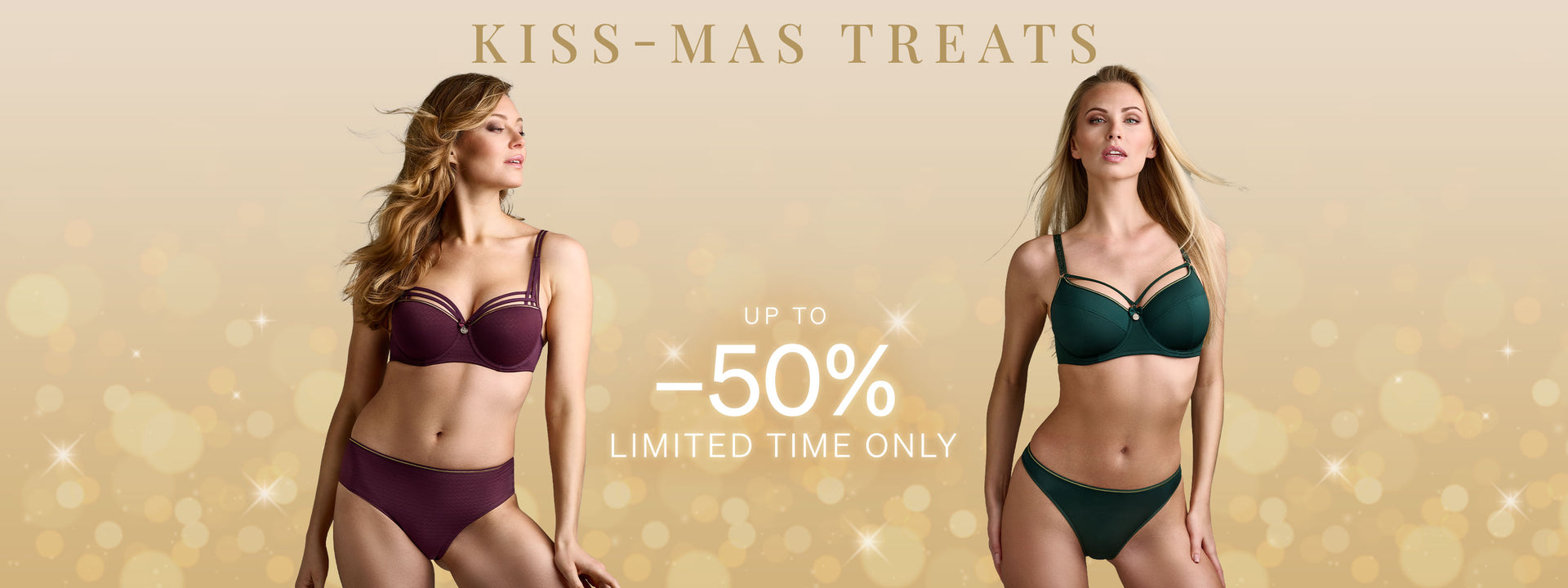 Two models wearing aubergine & green colored lingerie with sparkles in the background for Kiss-Mass treats promotion