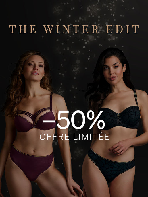 Deux mannequins portant l'ensemble murmure aubergine Dame de Paris & l'ensemble lurex noir & doré The Adventuress. Fond sombre avec des flocons de neige pour la promotion Winter Edit de marlies|dekkers avec -50%