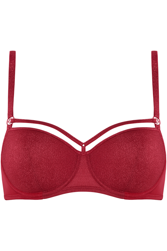 Steal the show in this sparkling red balcony bra. The Sparkly fabric is sprinkled with shinny laminated glitters and it contrasts beautifully with your skin tone. The playful straps on top of the cups adorn your décolleté. The padding of this red bra gives you extra support, and wires enclosing the entire breast create a modest cleavage. Look to its matchy-matchy bottoms to complete the set and start shining.